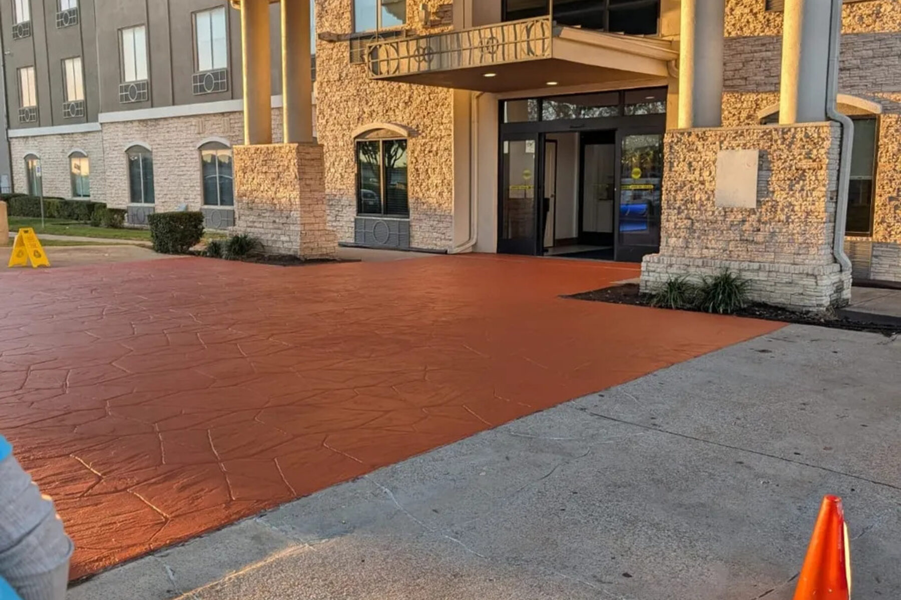 Stained concrete entry and paver walkway at a commercial building